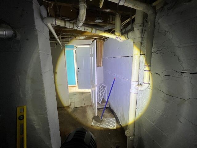 Clear Signs of Foundation issues are cracks along the cinderblock walls of the basement.