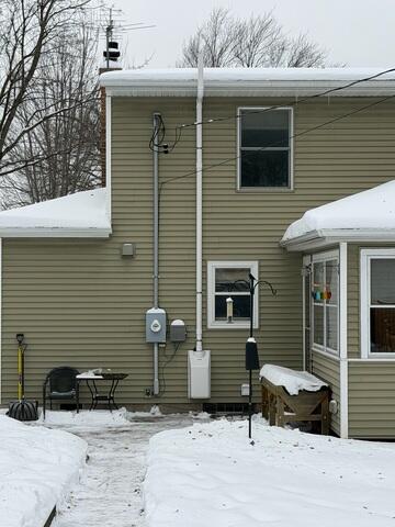 After: Our Foreman, Dakota, and his crew secured the Radon Mitigation System on the outside of the home.