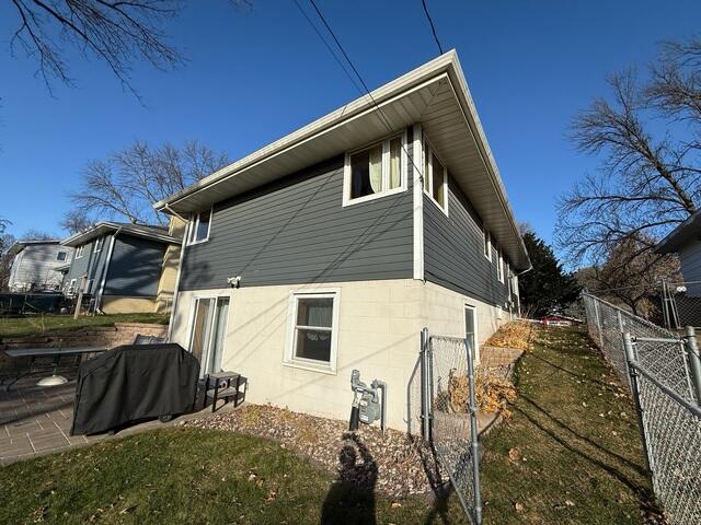 Before: Our Design Specialist, Romeo, recommended installing a Radon Mitigation System on the outside of the home.
