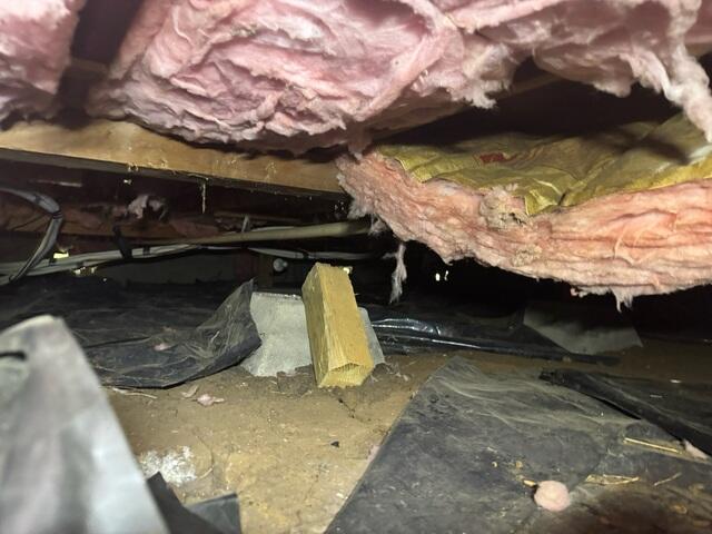 The floor upstairs in this area was sagging due to the post coming off of the footing. Excess moisture in the air caused the fiberglass insulation to start sagging also creating cold floors.