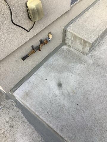 Our premium sealant provides a clean, flexible barrier that prevents water and debris from entering the control joints. The circular patches visible on the surface indicate where the high-density foam was injected to lift the slab.