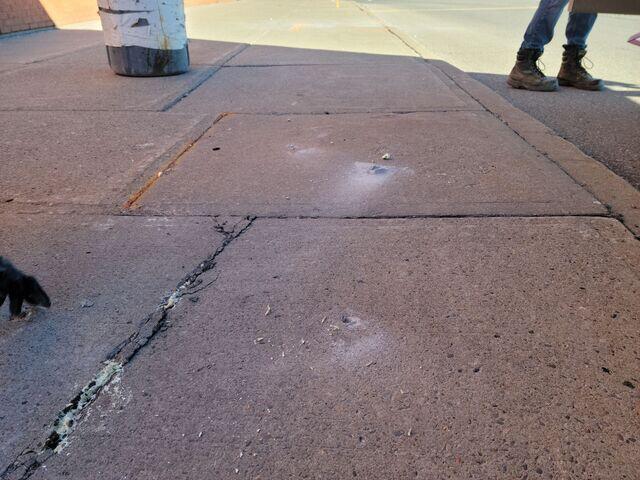 Post-injection view showing the precision-drilled access points used for the polyurethane lift. The slab has been successfully raised to a level grade, and the injection holes have been neatly filled to ensure a clean finish.