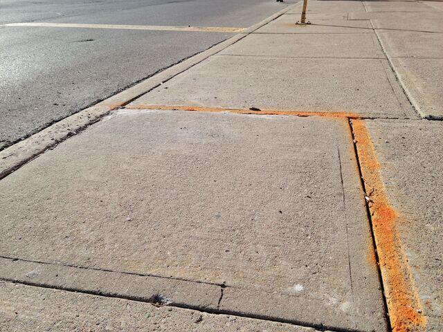 The completed sidewalk restoration. The trip hazard is fully mitigated and the walkway is restored to a safe, level condition, allowing immediate access for patrons without the need for costly concrete replacement.