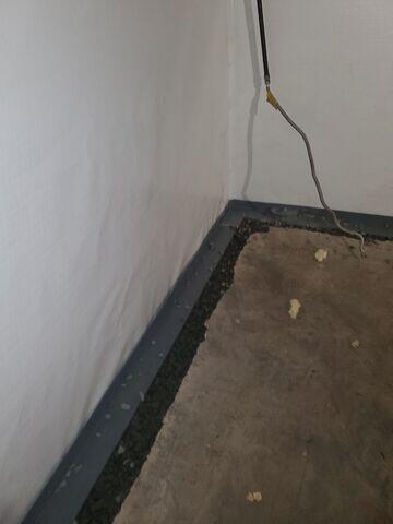 WaterGuard is an interior perimeter drainage system designed to capture water from basement walls and floors before it reaches the living space. It redirects seepage safely to the sump pump, keeping the basement dry even during heavy rains.