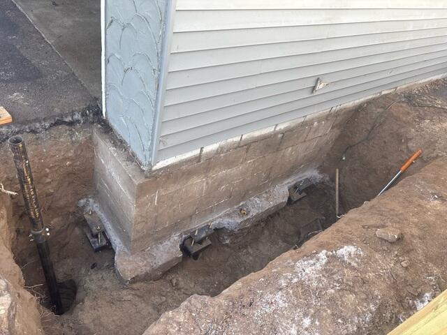 During: Our Foreman, Jesus, and his crew secured three Helical Piers along the struggling wall.