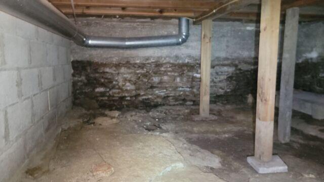 Before: Eric, one of our Design Specialists, recommended installing waterproofing products throughout the basement.