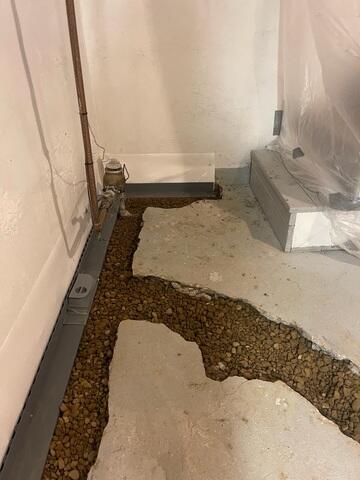 During: Our Foreman, Raul, and his crew secured waterproofing products throughout the basement.