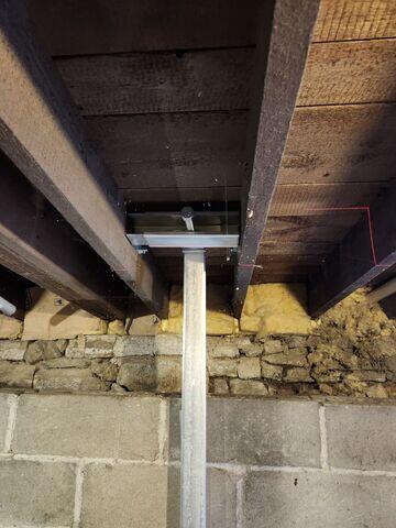 During: Arturo, one of our Foremen, secured all the PowerBraces on the damaged walls.