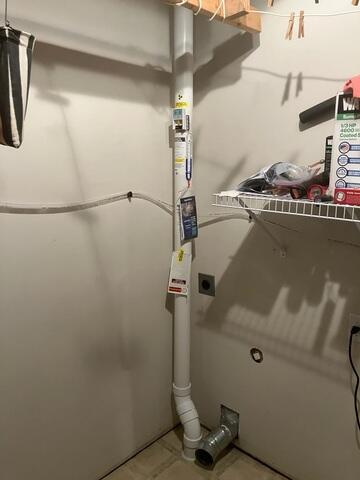 During: Our Foreman, Dakota, and his crew secured the Radon Mitigation System inside the home.
