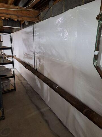 CleanSpace and WaterGuard were installed in the basement, with CleanSpace on the walls to seal off any moisture and odors and WaterGuard being installed under the floor slab to direct seeping water to the sump pump for removal.