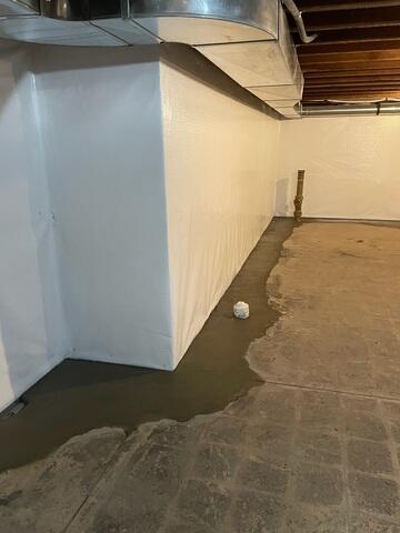 WaterGuard is an interior drainage system installed along the perimeter of the basement to capture water seepage from the walls and floor. It redirects water safely to the sump pump, preventing flooding and keeping the basement dry.