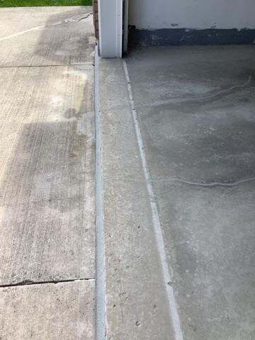 Sealing the Threshold After leveling the garage entrance, we applied our Premium Crack and Joint Sealant to the expansion joint to create a watertight barrier against foundation damage.