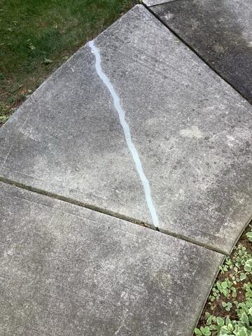 Structural Protection Once the driveway was stabilized and leveled, we used our professional-grade sealant to close jagged cracks, preventing water from eroding the subgrade in the future.