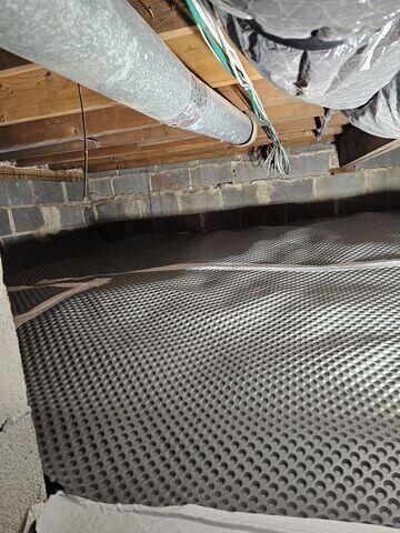 Our crew installed Drainage Matting to efficiently channel water away from vulnerable areas of the crawl space, preventing pooling and reducing hydrostatic pressure on the foundation, which protects the home from long-term water damage.