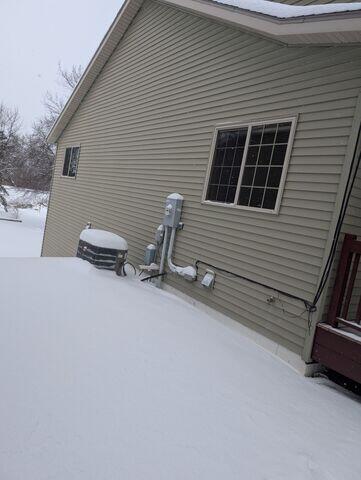 Before: Our Design Specialist, James, recommended securing a Radon Mitigation System outside the home.