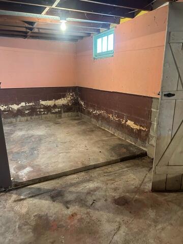Before: Our Design Specialist, Dylan, suggested installing waterproofing products throughout the water-damaged basement.