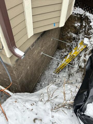 During: Our Foreman, Jose, and his crew secured eight GeoLock Wall Anchors on the east and south wall.