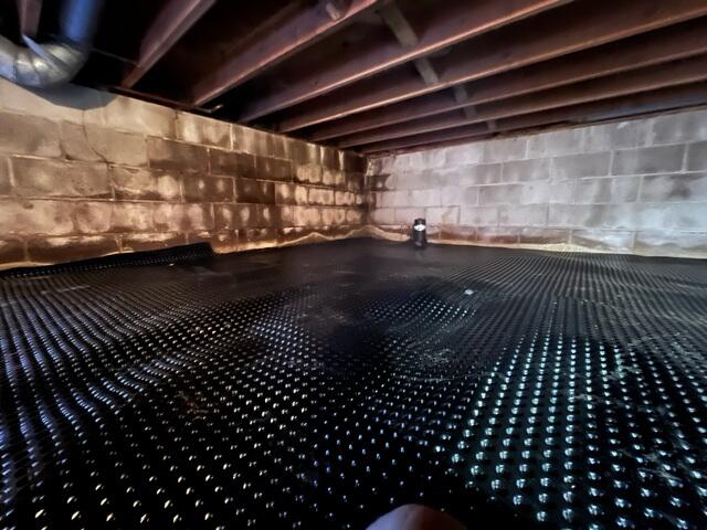 During: Our Foreman, Jesus, and his crew laid Drainage Matting and attached CleanSpace to the crawl space.