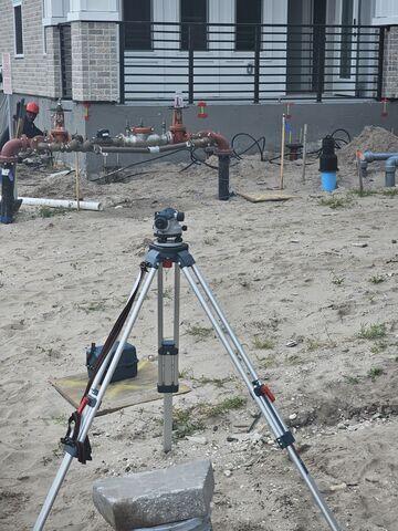 Monitoring structural lift with survey instruments.
