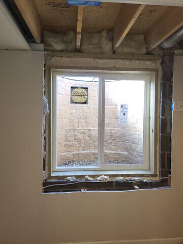 Inside look at the Egress Window, providing a safety exit route for a finished basement in Queensbury, NY