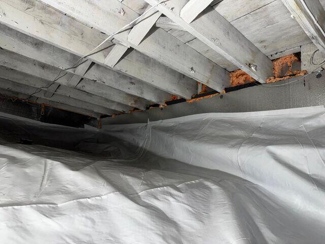 Our CleanSpace Vapor Barrier System was installed to fully encapsulate the crawl space and block ground moisture from entering the area.
