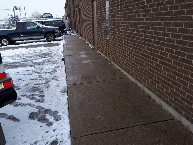 Using high-density polymer injection, the slabs were stabilized and lifted as close to their original grade as possible to restore a safe, uniform walking surface. The application of premium joint sealant now provides a watertight barrier, protecting the area from harsh Canadian winter conditions and preventing future shifting.