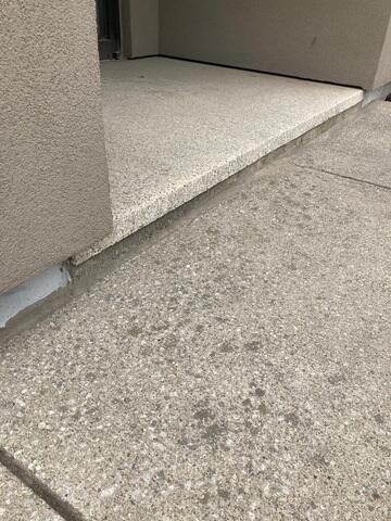 The entrance after the slab was stabilized and the premium sealant was applied. The gap is now fully protected, ensuring that moisture cannot penetrate the transition point even during heavy snow or rain.
