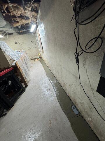 We installed our WaterGuard Drainage System to intercept water seepage at the basement perimeter before it could spread across the floor. By relieving hydrostatic pressure and directing water away from the foundation, this patented system prevents damp walls, pooling water, and long-term moisture damage.