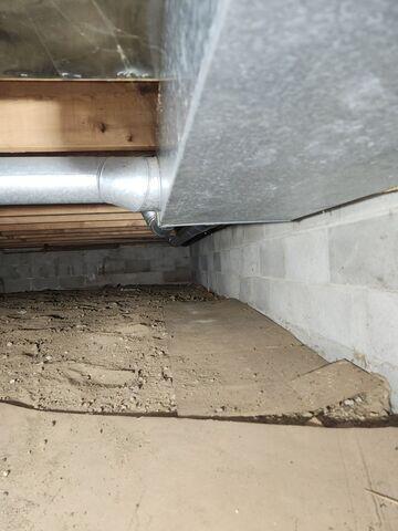 Before: Eric, one of our Design Specialists, recommended securing products in the damaged crawl space.