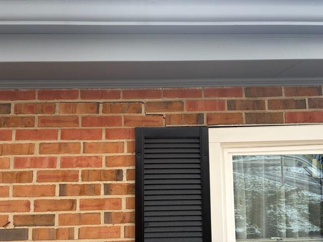 This picture, taken before we started the work, shows a crack sprawling from the top left corner of the window.