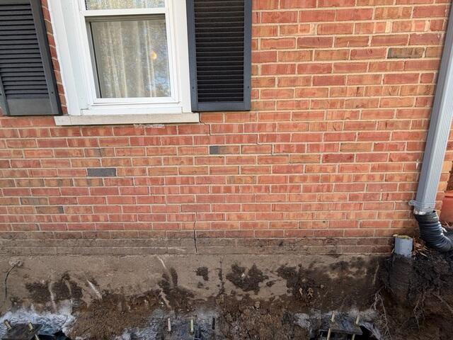 This photo shows the closed crack near the bottom right side of the window. This was after we lifted the piers using hydraulic power. We even had the customer try and open their window again after we lifted the home. She was able to open and close the window with ease, something she hadn't been able to do in months.