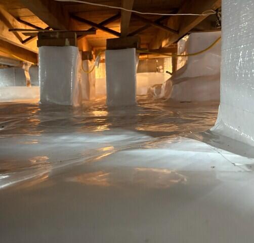 Now the crawl space is properly insulated with our SilverGlo wall insulation and completely encapsulated with our CleanSpace vapor barrier.