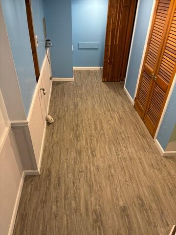 In order to complete the transformation, we installed ThermalDry Elite Plank Flooring to provide a warm, comfortable, and waterproof flooring solution. Designed specifically for basement environments, this flooring resists moisture while helping to insulate the space from cold concrete below.