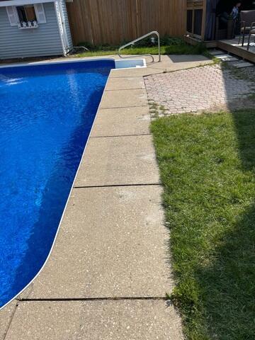 Pool deck after concrete stabilization, with improved surface alignment and a safer, more uniform transition along the pool perimeter.
