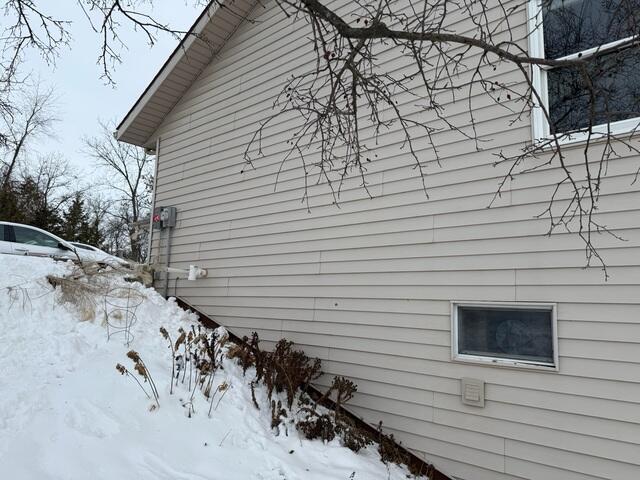 Before: Our Design Specialist, Nathan, recommended securing a Radon Mitigation System outside the home.