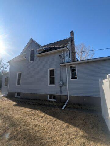 Before: Our Design Specialist, Derek, recommended securing a Radon Mitigation System outside the home.