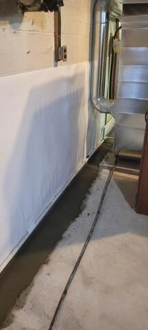 AFTER - We installed cleanspace vapor barrier and water guard subfloor drainage system