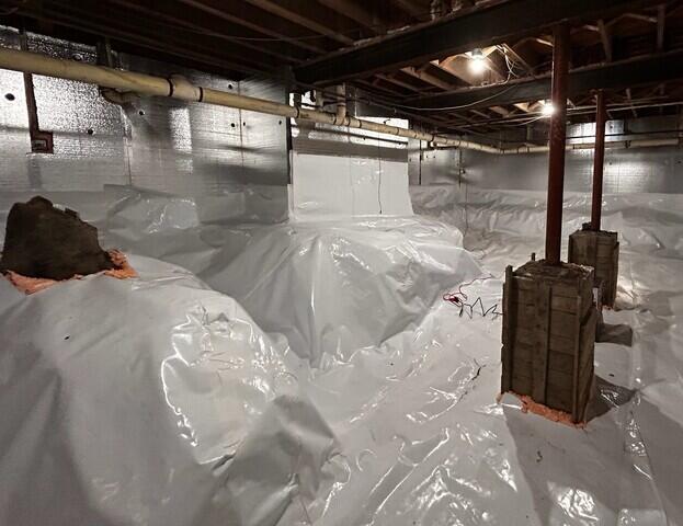 The crawl space is now properly encapsulated with our CleanSpace vapor barrier.