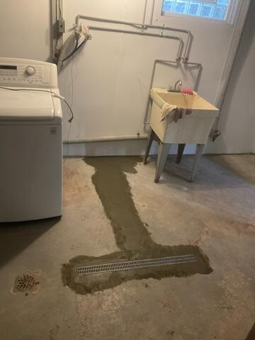 The crew installed our TrenchDrain System to effectively capture surface water seeping into the basement along the perimeter where walls meet the floor.