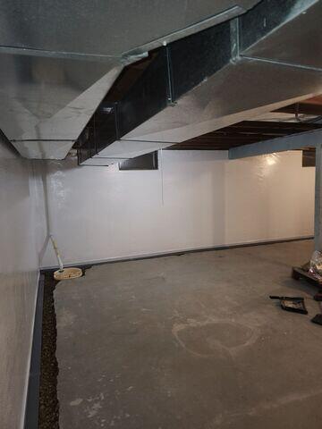 During: Our Foreman, Lane, and his crew successfully secured all the waterproofing products in the water-damaged basement.