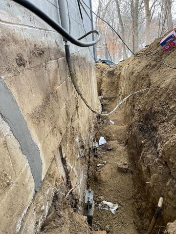 During: Our Foreman, Gabriel, and his crew secured Helical Piers along the struggling wall.