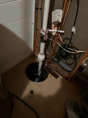 Before: Our Design Specialist, Dylan, recommended securing several waterproofing products throughout the basement.