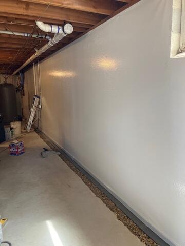 During: Our Foreman, Gabriel, and his crew secured the waterproofing products in the home.