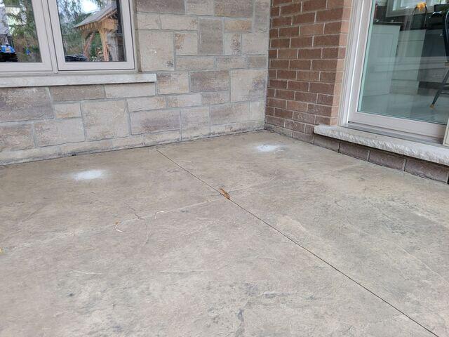 Slabs are leveled and stabilized. The fresh seal eliminated the white spots and restored the rich, natural color of the stamped pattern.