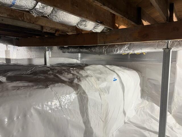 This was what the crawl space looked like after we encapsulated it. Our CleanSpace vapor barrier will keep moisture out of the space. We also took out the moisture soaked fiberglass from the ceiling.