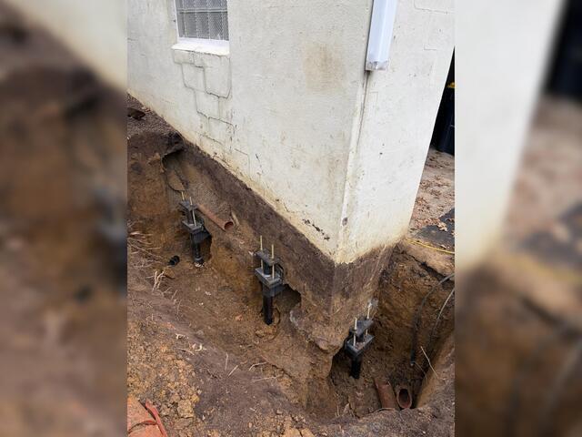We dug underneath the garage foundation to install our piers. Here is a zoomed-out view of the piers we installed.
