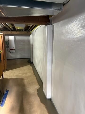 To protect the basement walls from moisture and improve the overall environment, our crew installed CleanSpace Wall Panels.