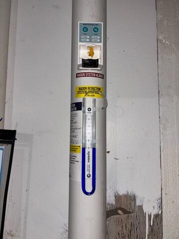 During: Our Foreman, Dakota, and his crew secured the Radon Mitigation System in the sump pump.