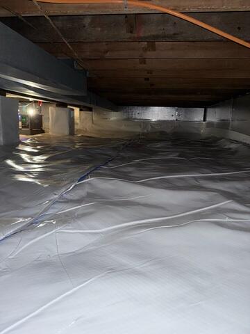 Our CleanSpace Vapor Barrier was installed to create a durable, sealed barrier between the crawl space and the surrounding ground, preventing groundwater seepage and moisture-laden air from entering the space.