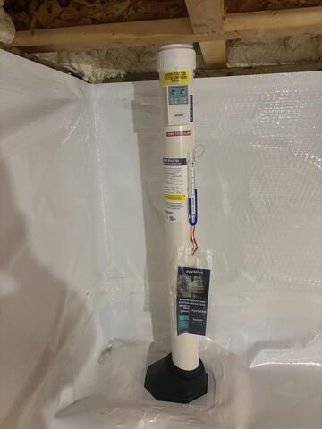 During: Our Radon Sales & Service Technician, Jackson, successfully secured the radon mitigation system in the home.